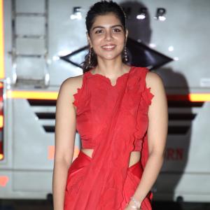 Kalyani Priyadarshan Stuns in Red Saree at Event – Elegant and Graceful Look