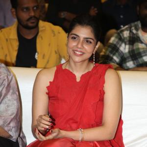 Kalyani Priyadarshan Stuns in Red Saree at Event – Elegant and Graceful Look