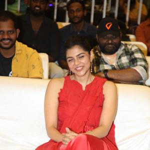 Kalyani Priyadarshan Stuns in Red Saree at Event – Elegant and Graceful Look