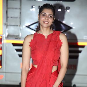 Kalyani Priyadarshan Stuns in Red Saree at Event – Elegant and Graceful Look