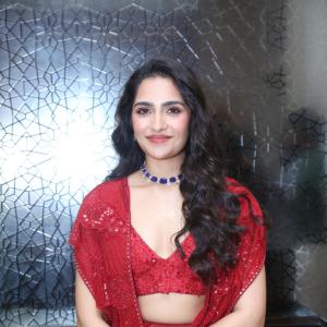 Rukmini Vasanth in Glamorous Red Lehenga Look with Blue Choker