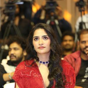 Rukmini Vasanth in Glamorous Red Lehenga Look with Blue Choker