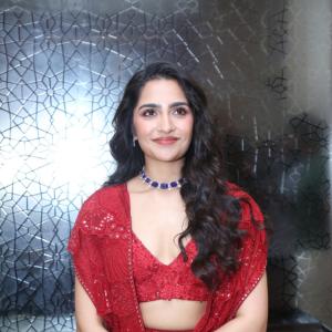 Rukmini Vasanth in Glamorous Red Lehenga Look with Blue Choker