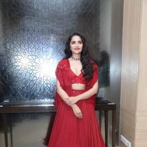 Rukmini Vasanth in Glamorous Red Lehenga Look with Blue Choker