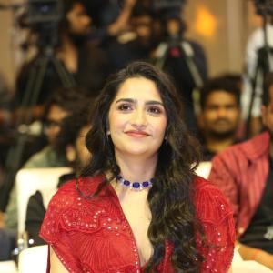 Rukmini Vasanth in Glamorous Red Lehenga Look with Blue Choker