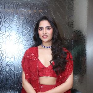 Rukmini Vasanth in Glamorous Red Lehenga Look with Blue Choker