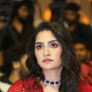 Rukmini Vasanth in Glamorous Red Lehenga Look with Blue Choker