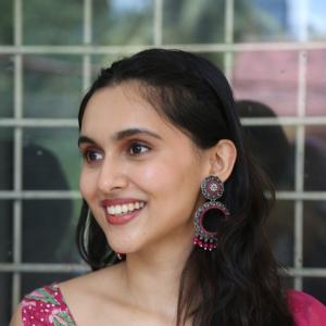 Actress Riya Jithu Radiates Elegance in Pink Floral Ethnic Outfit