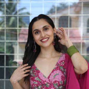 Actress Riya Jithu Radiates Elegance in Pink Floral Ethnic Outfit