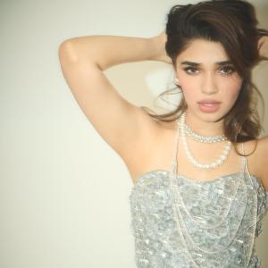 Kriti Shetty Shines in Glamorous Silver Outfit with Pearl Jewelry