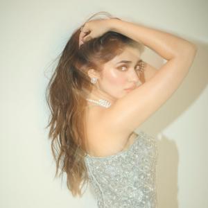 Kriti Shetty Shines in Glamorous Silver Outfit with Pearl Jewelry