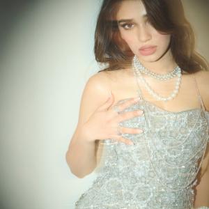 Kriti Shetty Shines in Glamorous Silver Outfit with Pearl Jewelry