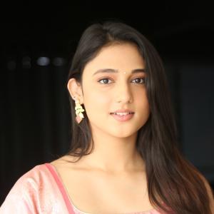 Ritika Nayak Looks Elegant in Pink Silk Saree with Golden Accessories