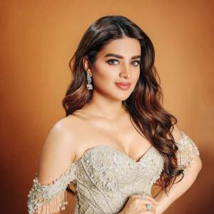 Nidhhi Agerwal Shines in Stunning Off-Shoulder Gown