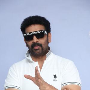 J.D. Chakravarthi Flaunts Stylish Look in White Polo and Designer Shades