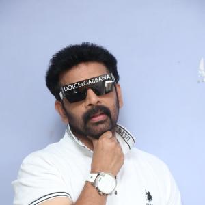 J.D. Chakravarthi Flaunts Stylish Look in White Polo and Designer Shades