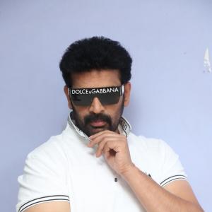 J.D. Chakravarthi Flaunts Stylish Look in White Polo and Designer Shades