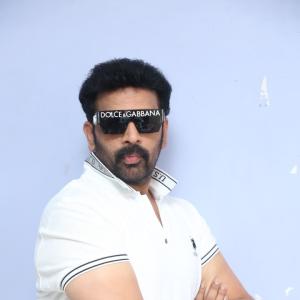 J.D. Chakravarthi Flaunts Stylish Look in White Polo and Designer Shades