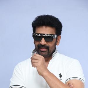 J.D. Chakravarthi Flaunts Stylish Look in White Polo and Designer Shades