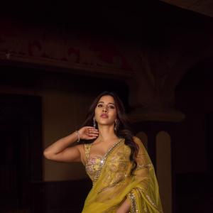 Nabha Natesh Stuns in Vibrant Yellow Saree with Designer Blouse