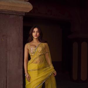 Nabha Natesh Stuns in Vibrant Yellow Saree with Designer Blouse