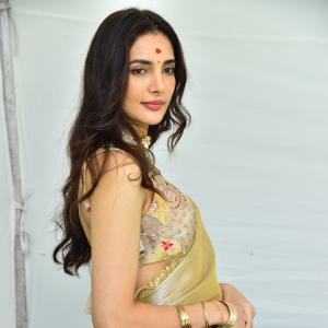 Actress Nakshatra Shines in Golden Saree at Movie Event