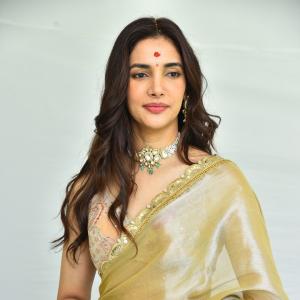 Actress Nakshatra Shines in Golden Saree at Movie Event