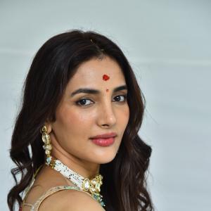 Actress Nakshatra Shines in Golden Saree at Movie Event