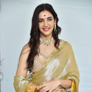 Actress Nakshatra Shines in Golden Saree at Movie Event