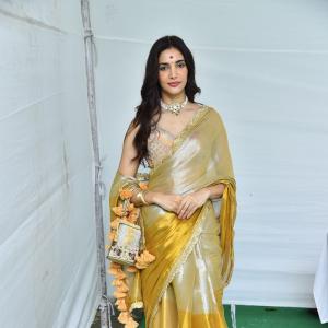 Actress Nakshatra Shines in Golden Saree at Movie Event