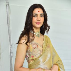 Actress Nakshatra Shines in Golden Saree at Movie Event