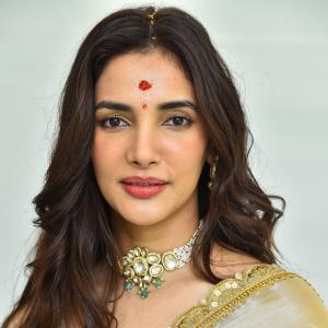 Actress Nakshatra Shines in Golden Saree at Movie Event