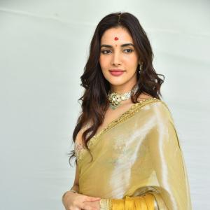 Actress Nakshatra Shines in Golden Saree at Movie Event