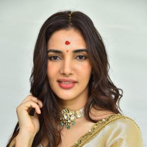 Actress Nakshatra Shines in Golden Saree at Movie Event