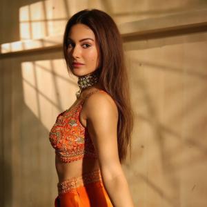 Amyra Dastur Stuns in Vibrant Orange Embellished Saree-Inspired Outfit