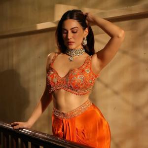 Amyra Dastur Stuns in Vibrant Orange Embellished Saree-Inspired Outfit