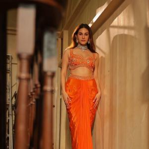 Amyra Dastur Stuns in Vibrant Orange Embellished Saree-Inspired Outfit