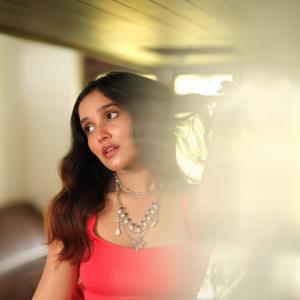 Elegant Red Outfit and Chic Accessories - Actress Anika Surendran