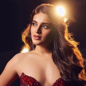 Nidhhi Agerwal Dazzles in Red Dress - A Glimpse of Glamour