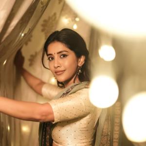 Actress Nabha Natesh Shines in an Elegant Green and Gold Saree