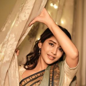 Actress Nabha Natesh Shines in an Elegant Green and Gold Saree