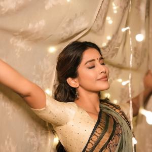 Actress Nabha Natesh Shines in an Elegant Green and Gold Saree