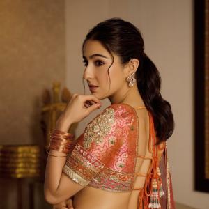 Actress Sara Ali Khan Dazzles in Traditional Peach and Gold Lehenga