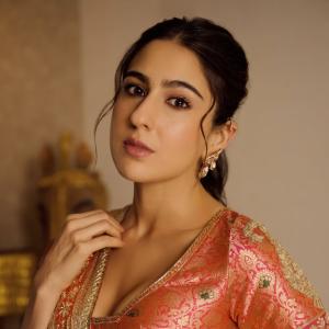 Actress Sara Ali Khan Dazzles in Traditional Peach and Gold Lehenga