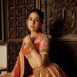 Actress Sara Ali Khan Dazzles in Traditional Peach and Gold Lehenga