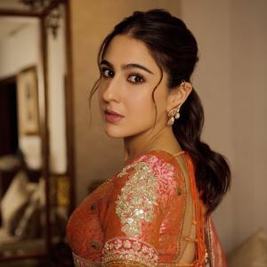 Actress Sara Ali Khan Dazzles in Traditional Peach and Gold Lehenga