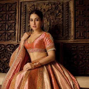 Actress Sara Ali Khan Dazzles in Traditional Peach and Gold Lehenga