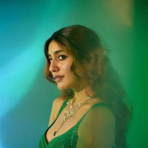 Actress Priya Warrior Dazzles in a Shimmering Green Gown
