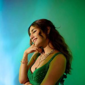 Actress Priya Warrior Dazzles in a Shimmering Green Gown