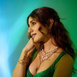 Actress Priya Warrior Dazzles in a Shimmering Green Gown